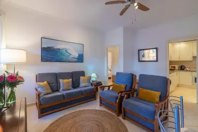 a living room with a couch and two chairs at Vilamoura - M M GARDEN - Magnifico T2 in Vilamoura