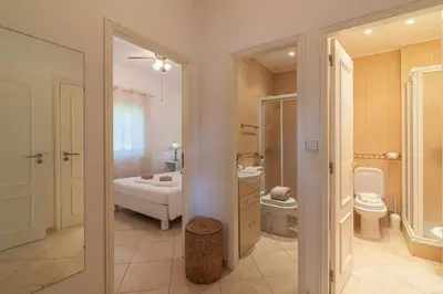 a bathroom with a sink and a toilet at Vilamoura - M M GARDEN - Magnifico T2 in Vilamoura