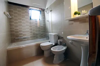 a bathroom with a toilet and a sink at Charming Villa by SAPvillas in Vilamoura