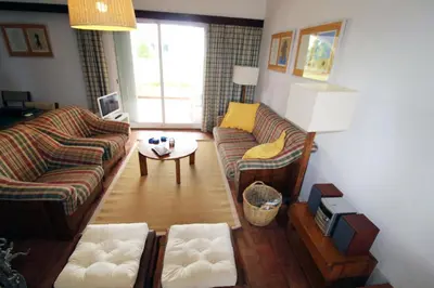 a living room with two couches and a table at Charming Villa by SAPvillas in Vilamoura