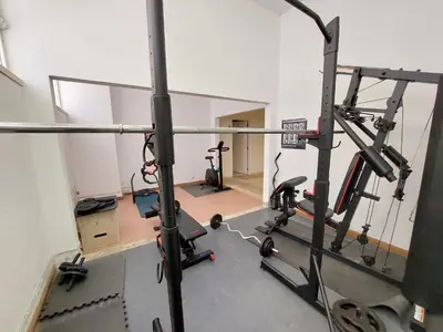 an empty room with a gym with a treadmill at Marina Mar Sea Breeze by SAPvillas in Vilamoura