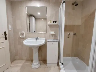 a bathroom with a sink and a mirror and a tub at Marina Mar Sailor by SAPvillas in Vilamoura