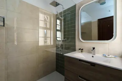 a bathroom with a sink and a mirror at Villa Mianas by SAPvillas in Vilamoura