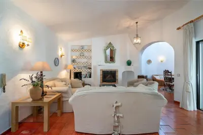 a living room with a large white room with a couch at Villa Serendipity by SAPvillas in Vilamoura