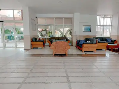 a living room with couches and chairs and tables at Marina Mar Marina by SAPvillas in Vilamoura