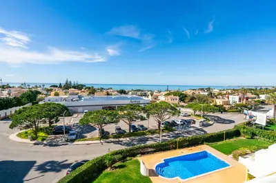 an aerial view of a parking lot with a swimming pool at Albufeira Beach Apartment in Guia