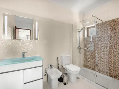 a bathroom with a toilet and a sink and a shower at Holiday Home Vivenda Deolinda by Interhome in Albufeira