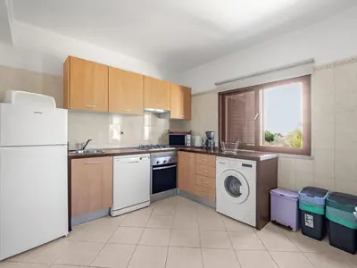 a kitchen with a white refrigerator and a dishwasher at Holiday Home Vivenda Deolinda by Interhome in Albufeira