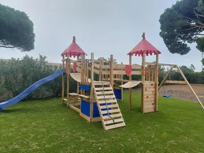 a playground with two swings and a slide at Dream Villa with Luxury Services - PROMOTION Last dates! in Vilamoura