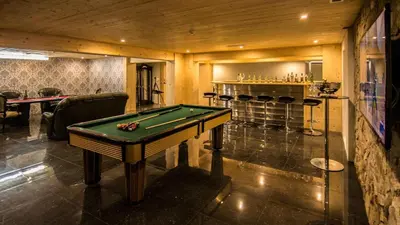 a pool table in a room with a bar at Dream Villa with Luxury Services - PROMOTION Last dates! in Vilamoura