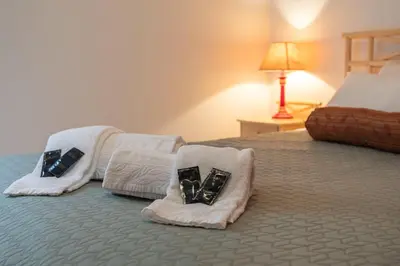 a bedroom with two beds with pillows on them at Centralgarve - Great, Bright 2-bedroom Flat in the Center of Vilamoura -Topázio in Vilamoura