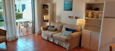 a living room with a couch and a table at Solar dos Pinheiros LC 303 in Quarteira