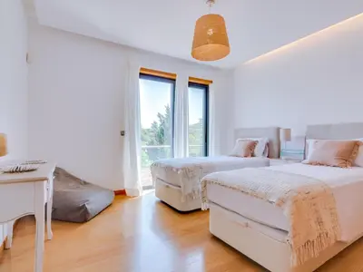 an aerial view of a house with a swimming pool at Vale do lobo, 'Golf by the Pool' 2 bedroom apartment in Vale do Lobo