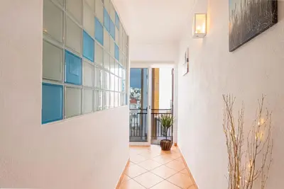 a hallway with a large window and a balcony at Sea & Sun OldTown in Albufeira