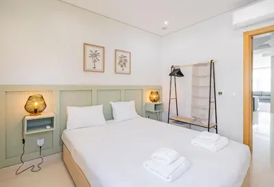 a bedroom with two beds and a window at Marina Sol by Atlantic Places in Albufeira