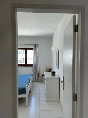 a room with a bedroom with a bed and a window at Sta. Eulalia Mar A36 in Albufeira