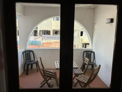 a view of chairs and tables on a balcony at Sta. Eulalia Mar A29 in Albufeira