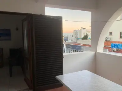 a room with an open door to a balcony at Sta. Eulalia Mar A29 in Albufeira