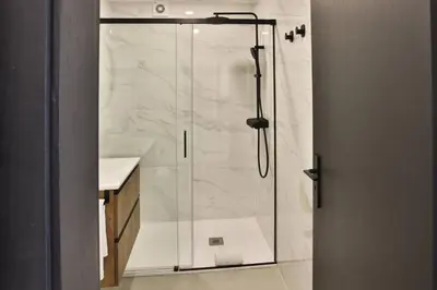 a shower with a glass door in a bathroom at Go4Portugal - Lagoa - Apartment 3 min from beach with airco and balcony in Quarteira
