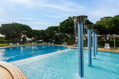 a pool with a water slide in a resort at Pedra dos Bicos by Intiholidays in Albufeira