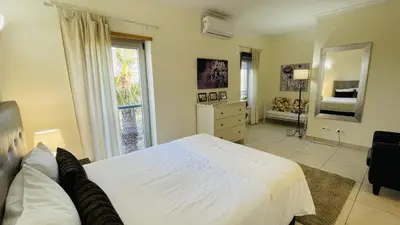 a bedroom with a large white bed and a window at Santa Maria C by Check-in Portugal in Albufeira