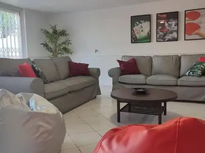a living room with a couch and a table at Vilamoura Golf Mansion by Stay ici Algarve Holiday Rental in Quarteira