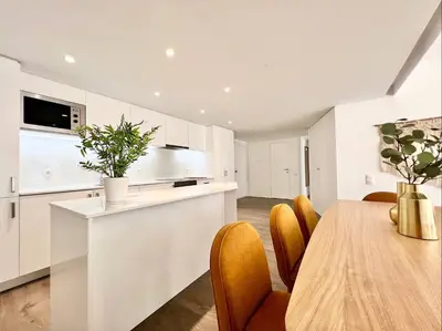 a kitchen and dining room with a table and chairs at Home Out Vilamoura 20 Levante in Vilamoura