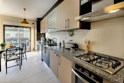 a kitchen with a stove and a counter top at RoofTop OldTown Residence in Albufeira