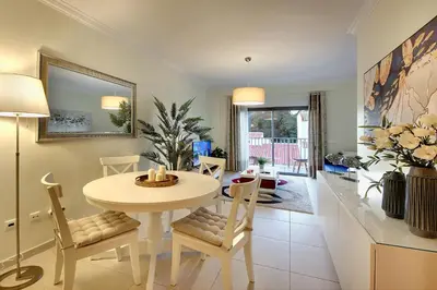 a kitchen and dining room with a table and chairs at RoofTop OldTown Residence in Albufeira