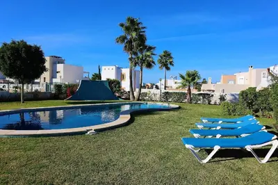 a living room with a couch and a table at Aldeia Joinal - Swimming Pool - FREE WIFI - BY BEDZY in Albufeira