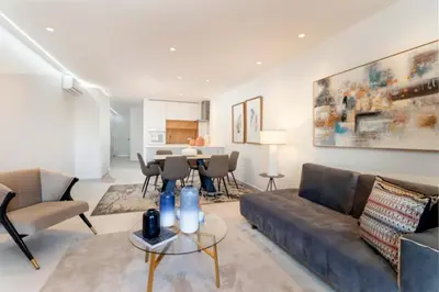 a living room with a couch and a table at Apartamento Albufeira Prestige by Sunnyway in Albufeira