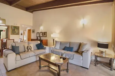 a living room with two couches and a coffee table at Vilamoura Tenis 58 in Quarteira