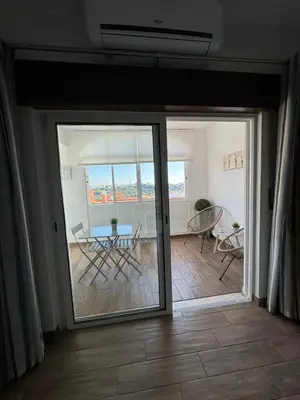 a living room with a couch and a table at Apartamento Oceano in Albufeira