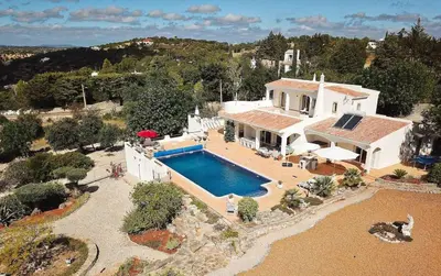 an aerial view of a house with a swimming pool at Villa Santa Barbara by Portucasa in Bordeira