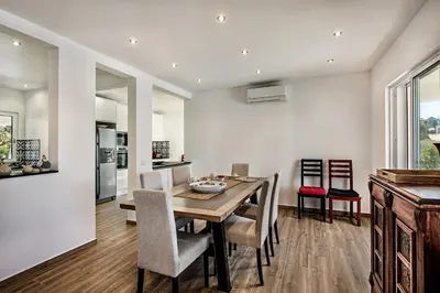 a kitchen and dining room with a table and chairs at Silva by Algarve Villa Holidays in Albufeira