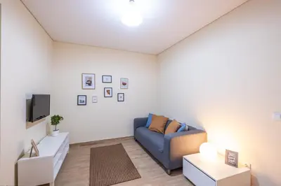 a small room with a bed and a refrigerator at #073 V3 Casa Verde by Home Holidays in Albufeira