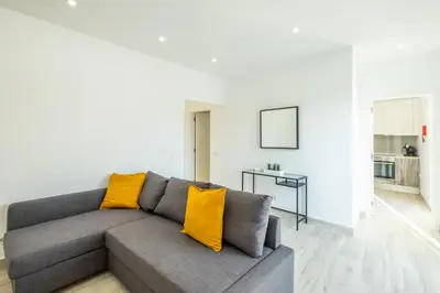 a patio with chairs and a table on a roof at #074 Casa dos Arcos by Home Holidays in Albufeira