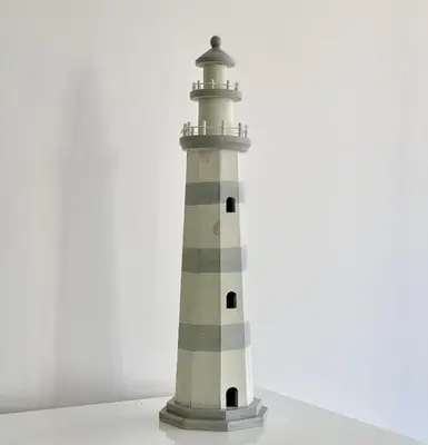 a model of a lighthouse on a white background at Ténis Studio Apartment - Vilamoura in Vilamoura
