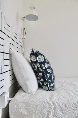 two pillows sitting on a bed in a bedroom at Ti Maria Guest House in Faro