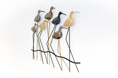 a group of birds standing in a formation at Casa da Vila in Faro