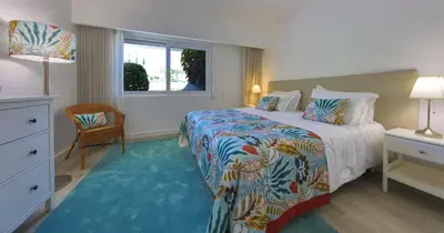 a hotel room with a bed and a window at Victory Village 20B in Quinta do Lago