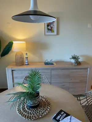 a living room with a table and a couch at Title e Title - Oura Apartament Albufeira in Albufeira