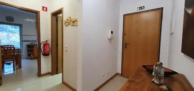a living room with a table and a fire hydrant at Apartamento Dionisio in Albufeira