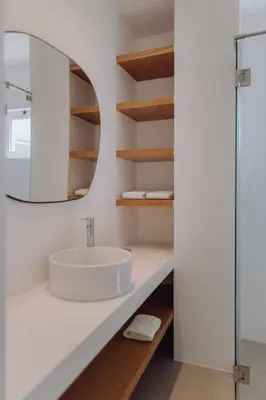 a bathroom with a sink and a mirror at Casa Balaia 70 in Albufeira