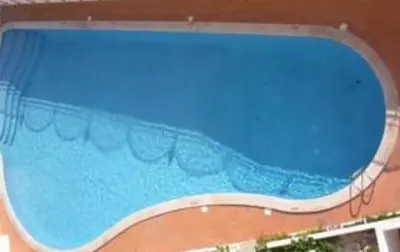a large swimming pool with a blue water at Sun way in Albufeira