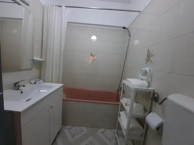a bathroom with a sink and a bath tub at Casa Oceano 1Bedroom apartment W/sea view in Quarteira