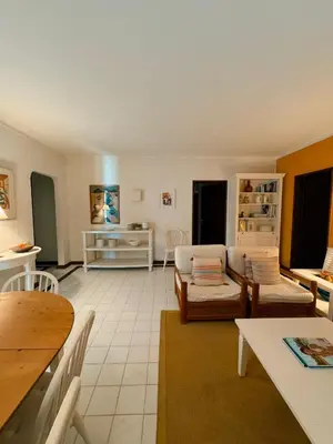 a living room with a couch and a table at T2 sobre a praia - Albufeira/Olhos de Água in Albufeira