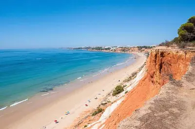 a view of a beach with people in the water at T2 sobre a praia - Albufeira/Olhos de Água in Albufeira