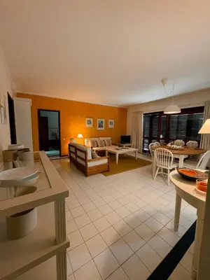 a living room with a couch and a table at T2 sobre a praia - Albufeira/Olhos de Água in Albufeira