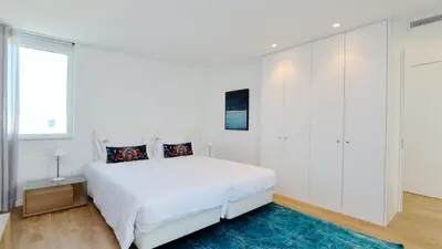 a white bedroom with a large bed and a window at Vila Leonor - Clever Details , Central Vilamoura, Sleeps 6, luxury, walking distance in Vilamoura
